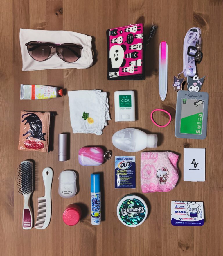 What's in my bag daily essentials in japan laid out in a neatly arranged almost-grid.