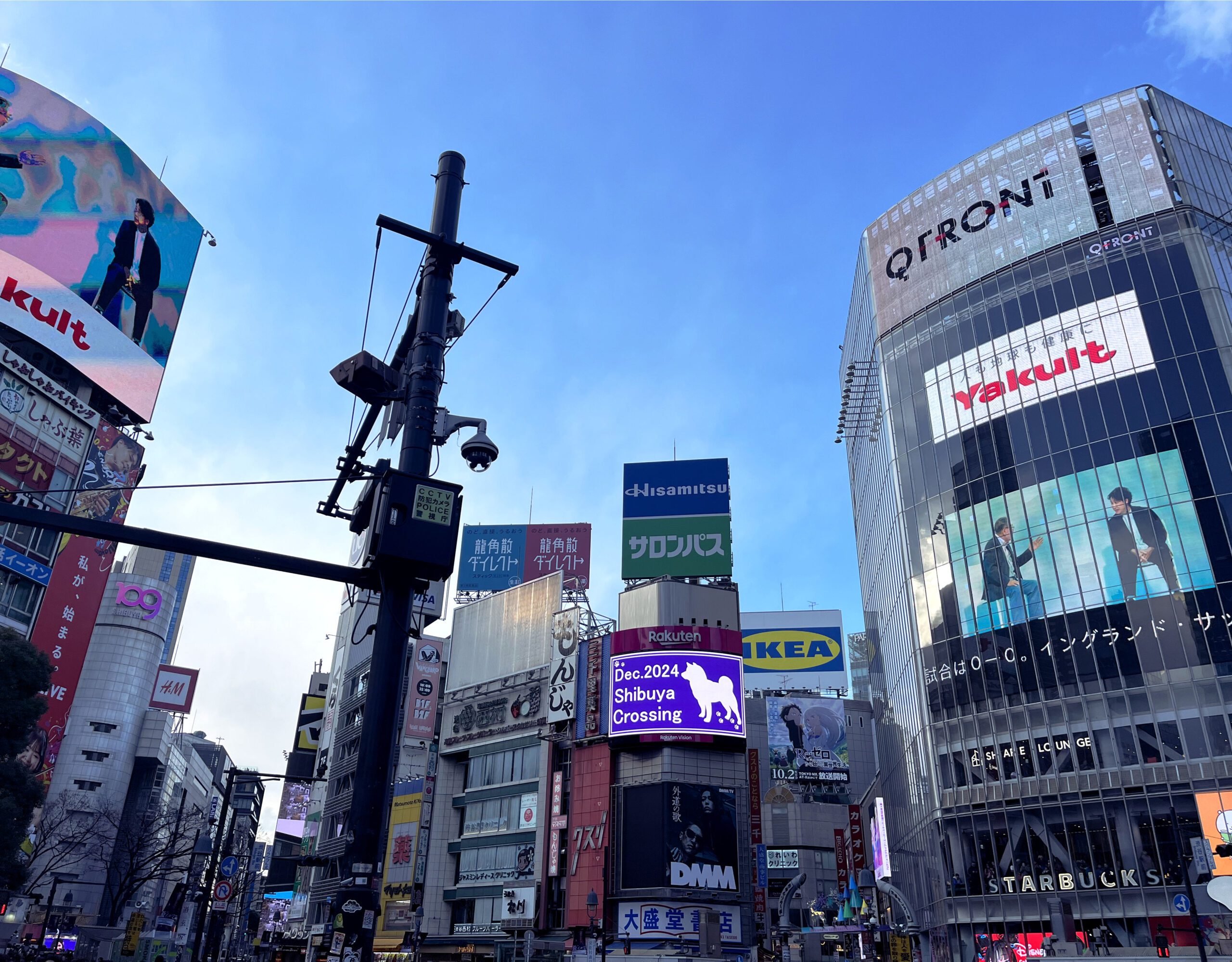 shibuya crossing with billboards and the 109