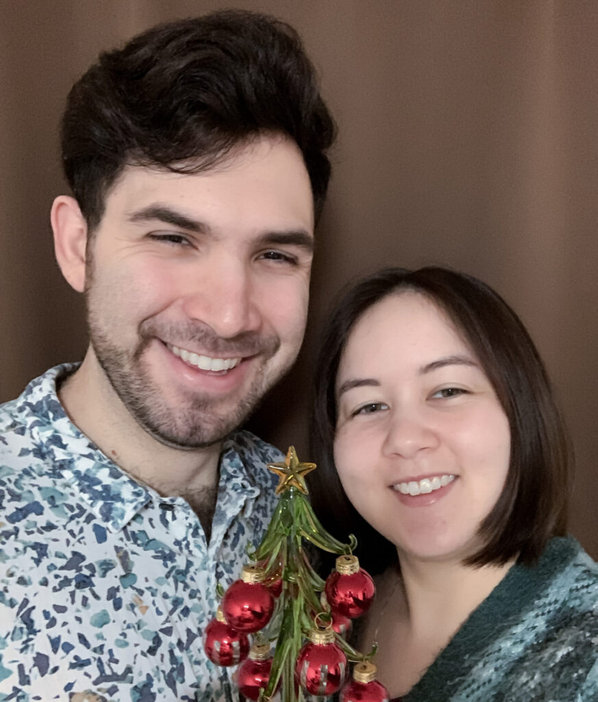 Kat and Ramón with a mini christmas tree