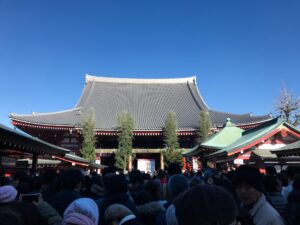 the crowded path at sensoji on new year's day for hatsumode. Ringing the Bell - Celebrating New Year's in Japan