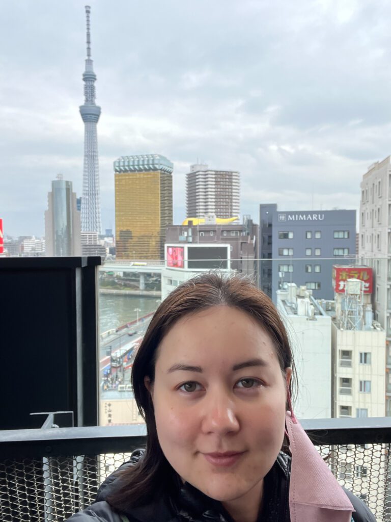 Asahi beer museum and skytree in the distance of my selfie