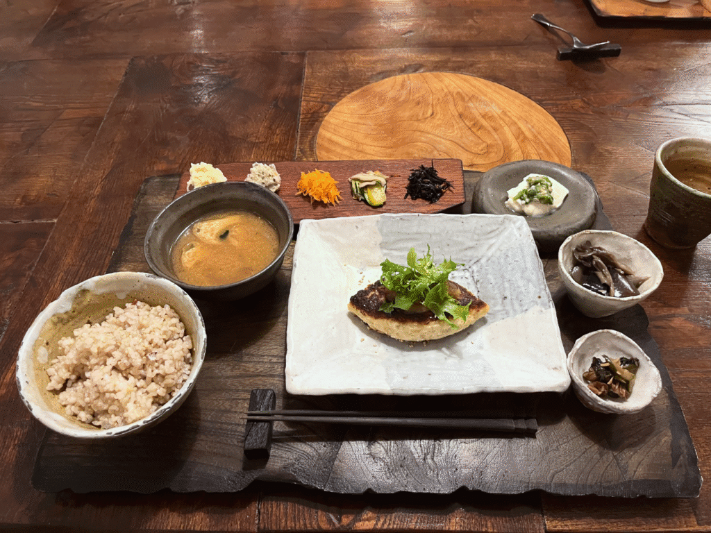 tofu hamburg with miso soup, and several side dishes