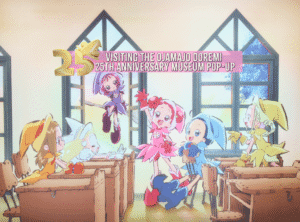 a photo from the exhibit "The Ojamajo Doremi 25th Anniversary Museum Pop-up" overlaid with text